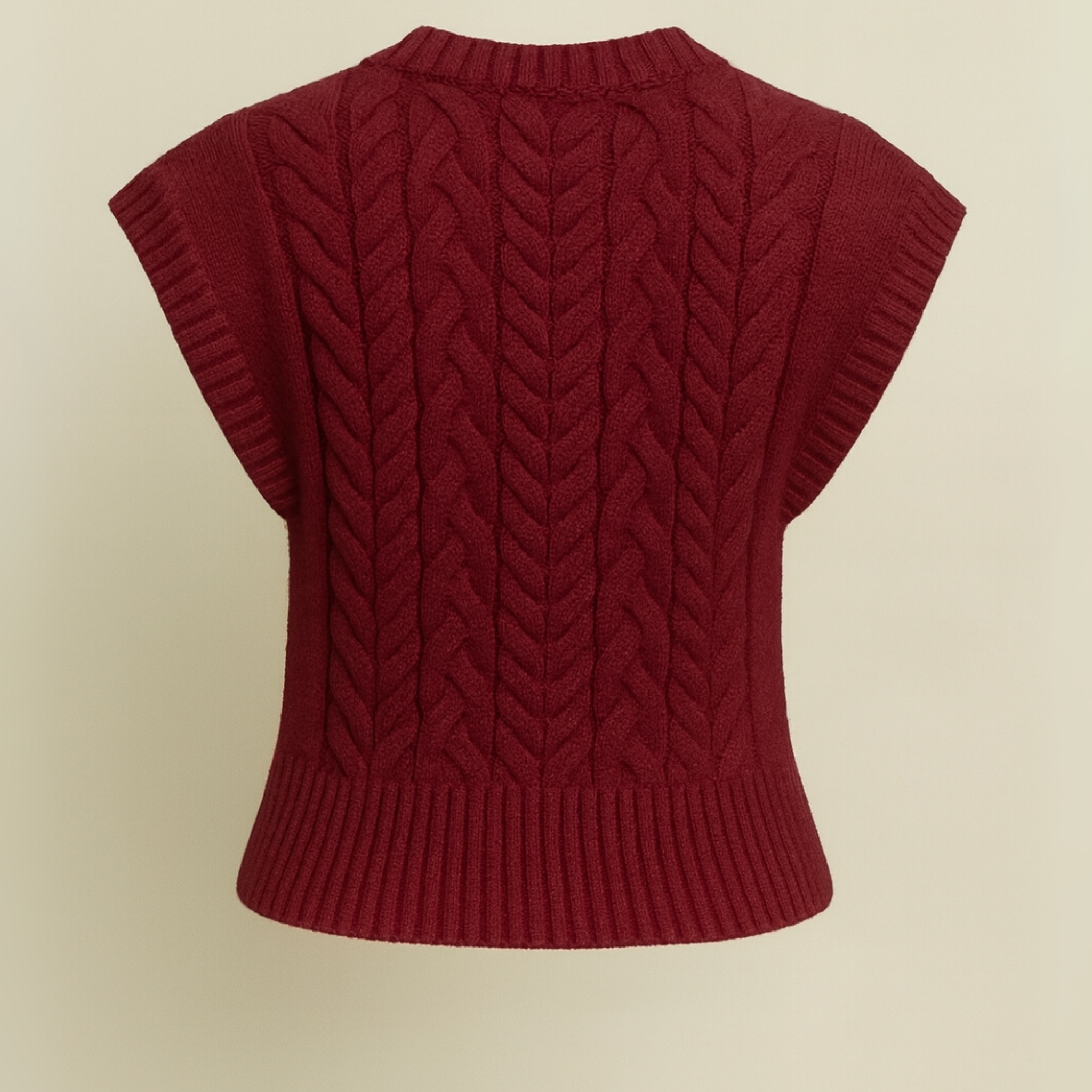 Back view of burgundy cable knit cropped sweater vest showing cable texture and ribbed finish